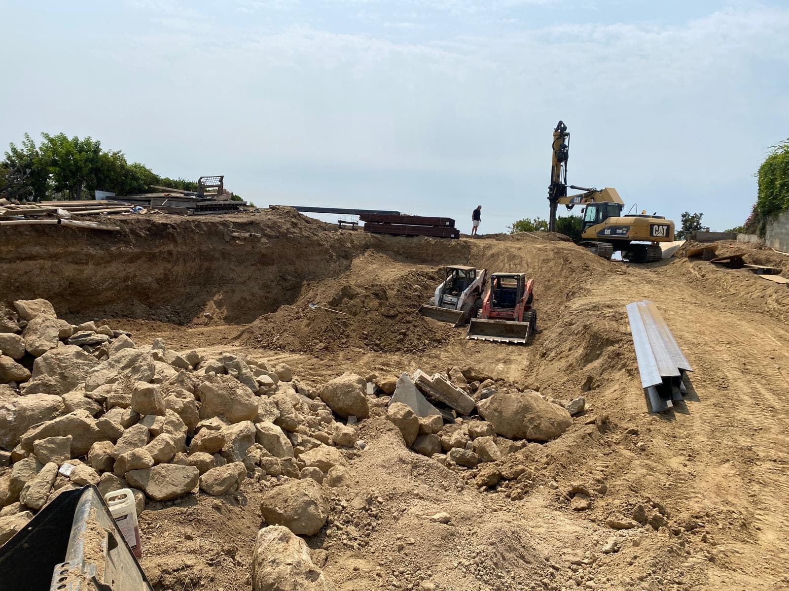 Pacific Palisades Site Development — Grading, shoring, framing, and concrete construction on a hillside site